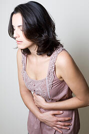 Woman with upset stomach